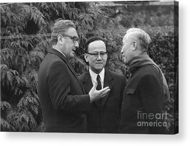 Vietnam War Acrylic Print featuring the photograph Henry Kissinger Talking With Le Duc Tho by Bettmann