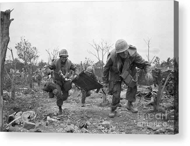 Vietnam War Acrylic Print featuring the photograph Medic Rushing To Aid Wounded Marine by Bettmann