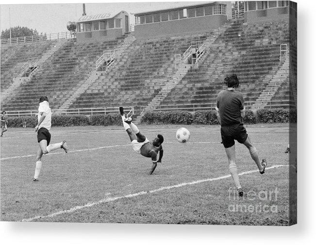 Pelé Acrylic Print featuring the photograph Pele Performing Tricky Soccer Maneuver by Bettmann