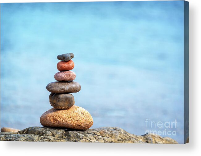 Balanced Acrylic Print featuring the photograph Pile of beach pebbles by Delphimages Photo Creations