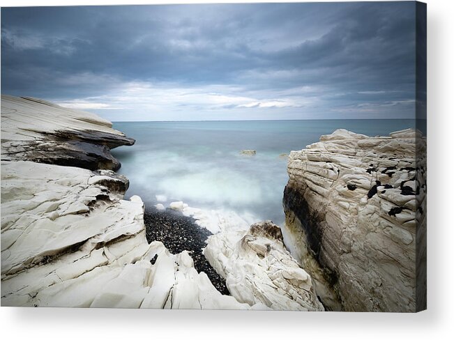 Seascape Acrylic Print featuring the photograph Rocky coast with white limestones and cloudy sky by Michalakis Ppalis