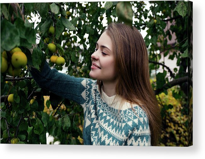 Woman Acrylic Print featuring the photograph Smiling Woman Picking Lemons From Tree While Standing In Yard by Cavan Images