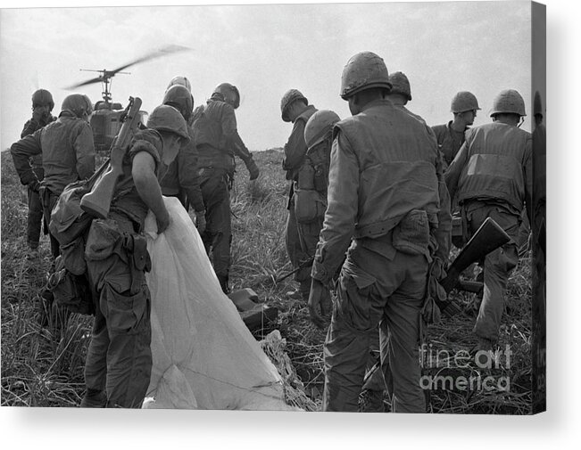 Vietnam War Acrylic Print featuring the photograph Soldiers Regrouping After Plane by Bettmann