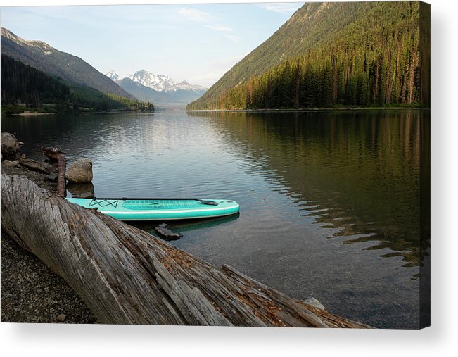 Sup Acrylic Print featuring the photograph Sup Board On Shore Of Lake On Background Of Mountain Ridge In Morning by Cavan Images