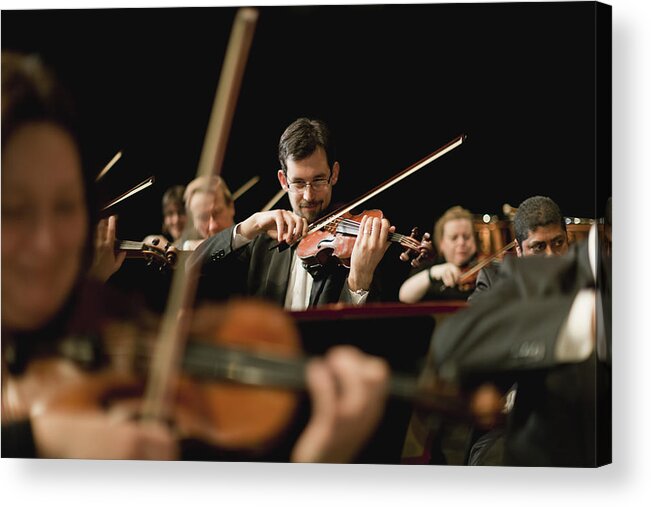 Young Men Acrylic Print featuring the photograph Violin Players In Orchestra by Hybrid Images
