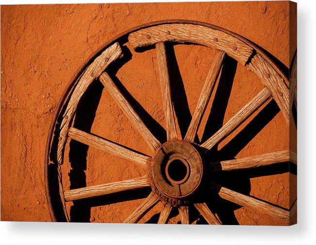 Shadow Acrylic Print featuring the photograph Weathered Wagon Wheel Against An Adobe by Photo By Sam Scholes