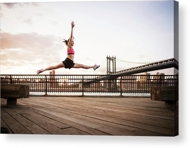 Woman Acrylic Print featuring the photograph Woman Doing Splits In Mid-air Over Promenade Against Sky by Cavan Images