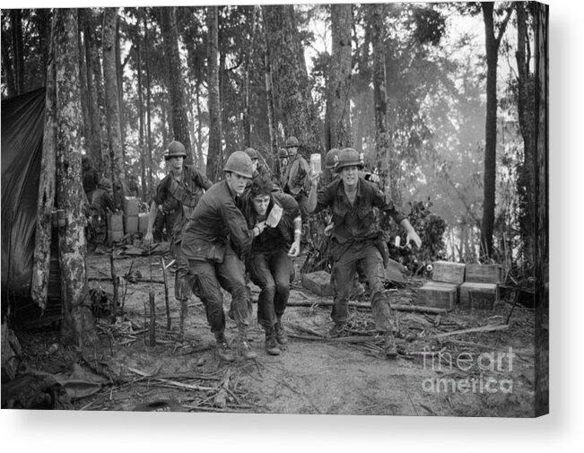 Vietnam War Acrylic Print featuring the photograph Wounded Soldier Taken To Helicopter by Bettmann