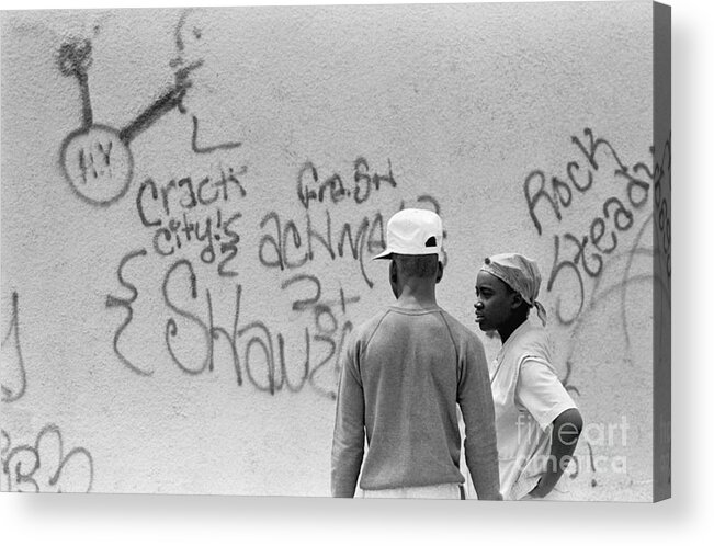 1980-1989 Acrylic Print featuring the photograph Youths Near Crack Graffiti by Bettmann