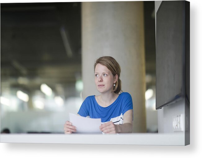 Working Acrylic Print featuring the photograph Woman working in office #1 by Sigrid Gombert