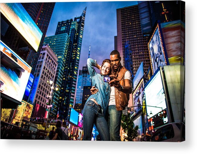 Young Men Acrylic Print featuring the photograph Mixed race couple walking around in New York City, taking selfies #2 by Itsskin
