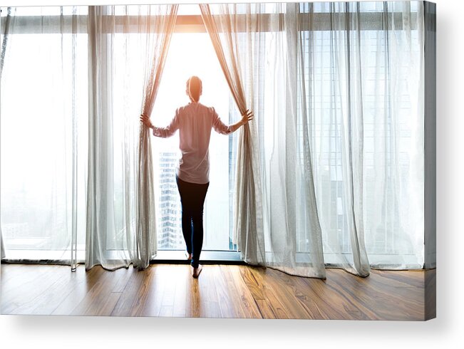 Human Arm Acrylic Print featuring the photograph Woman opening curtains and looking out #2 by Baona