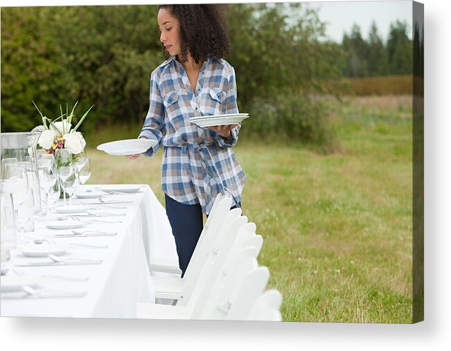 People Acrylic Print featuring the photograph Woman preparing table for dinner party in a field #2 by Image Source