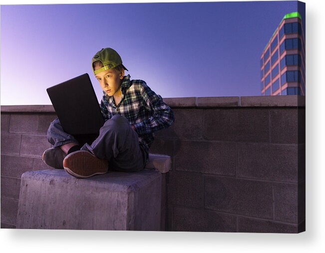 Dark Web Acrylic Print featuring the photograph A teenage boy hacking with a laptop computer to commit cyber crime #4 by Robb Reece