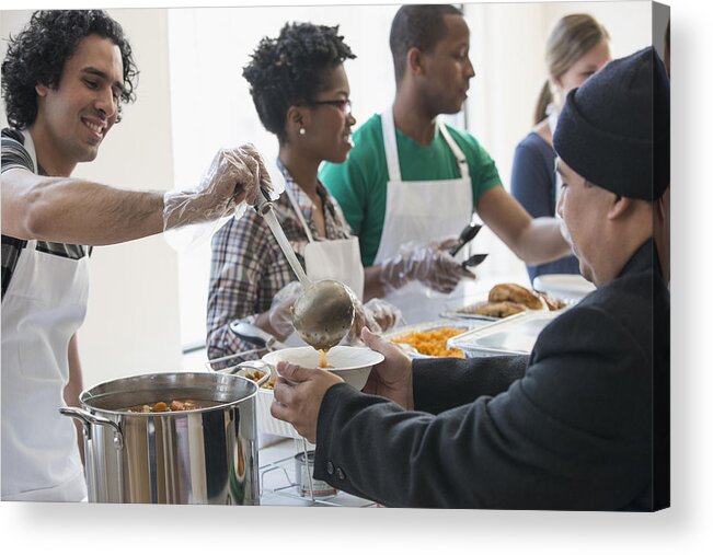 Young Men Acrylic Print featuring the photograph Volunteers serving food in cafeteria #6 by Jose Luis Pelaez Inc