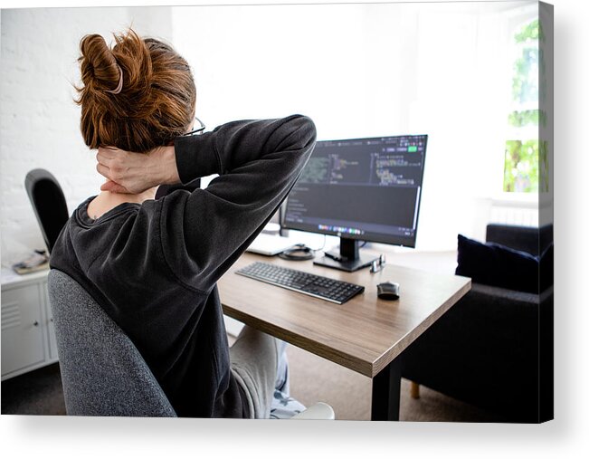 Working Acrylic Print featuring the photograph A woman holding her neck while working on computer sitting at desk at home by Photographer, Basak Gurbuz Derman