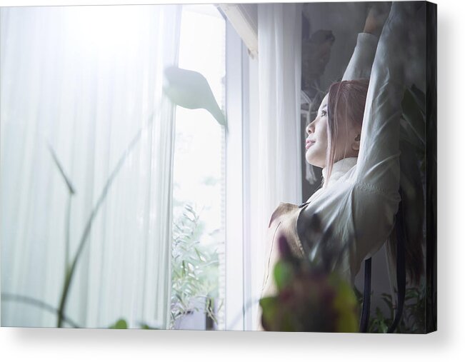 Mock Turtleneck Acrylic Print featuring the photograph A woman who grows while bathing in the morning sun by the window by Indigo Making Studio