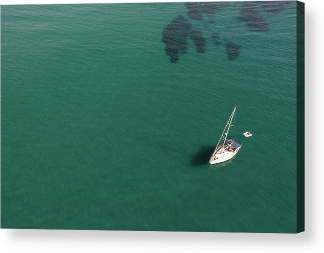 Anchored Acrylic Print featuring the photograph Aerial view of a luxury yacht anchored in the surface of the sea. Cyprus vacations by Michalakis Ppalis