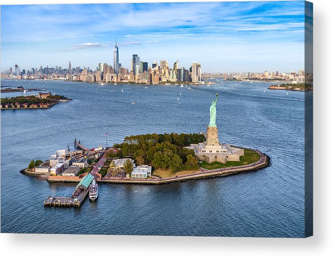 Lower Manhattan Acrylic Print featuring the photograph aerial view of the statue Liberty island in front of Manhattan skyline. New York. USA by Eloi_Omella