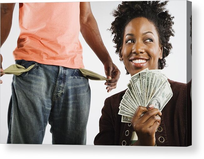 Heterosexual Couple Acrylic Print featuring the photograph African American woman holding money next to man with empty pockets by Hill Street Studios