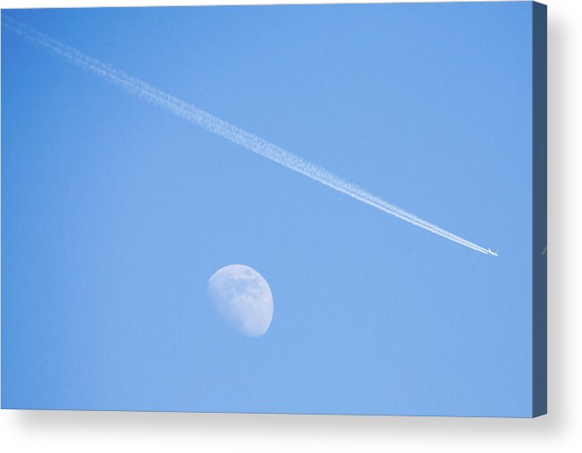 Plane Acrylic Print featuring the photograph Aircraft flying over moon leaving vapour trail during the day, S by Ian Middleton