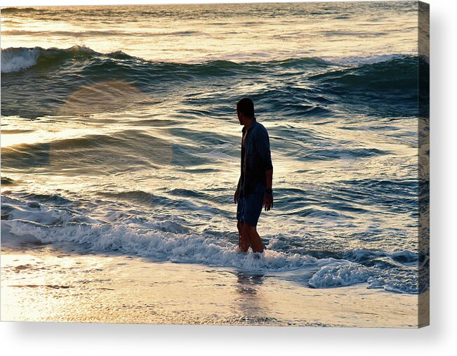 Man Acrylic Print featuring the photograph Backlit handsome man in the ocean during a beautiful sunset by Mark Stout
