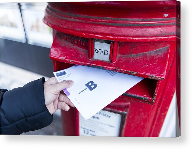 Democracy Acrylic Print featuring the photograph British Postal voting envelop is being dropping into a postbox by Sunphol Sorakul