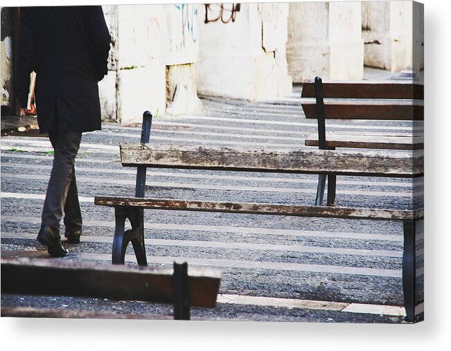 People Acrylic Print featuring the photograph Businessman walking outdoors between benches by Maurizio Siani