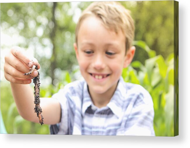 Environmental Conservation Acrylic Print featuring the photograph Caucasian boy examining worm by Emily Suzanne McDonald