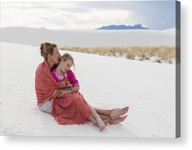 Mature Adult Acrylic Print featuring the photograph Caucasian mother and daughter wrapped in blanket on sand dune by Marc Romanelli