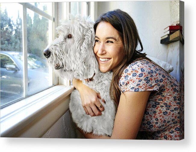 Pets Acrylic Print featuring the photograph Caucasian woman hugging dog at window by Blend Images - Peathegee Inc