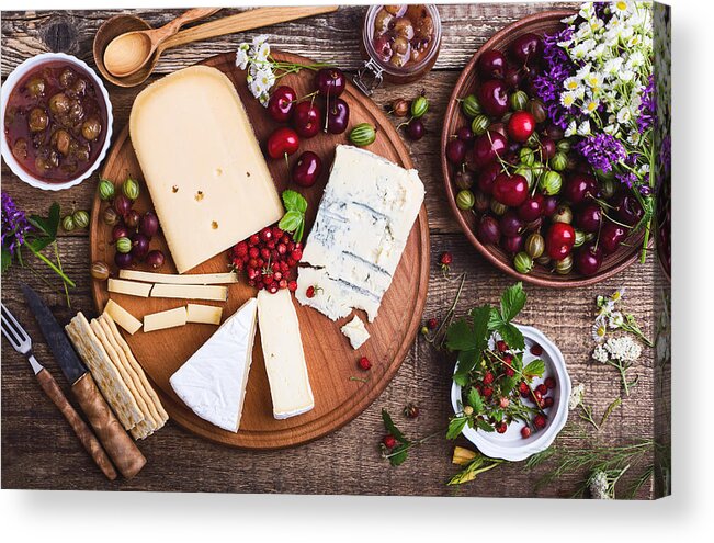 Cherry Acrylic Print featuring the photograph Cheese platter with fresh colorful summer berries by Istetiana