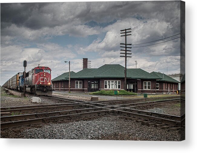 Railroad Acrylic Print featuring the photograph CN 5699 leads a southbound autorack south past the depot at Effingham Illinois by Jim Pearson