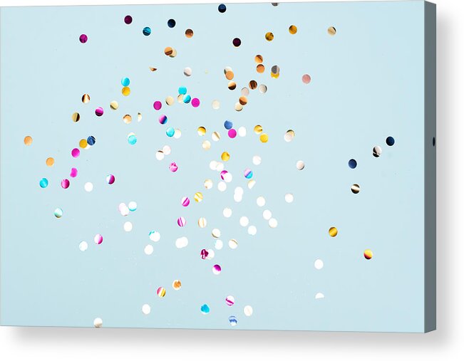 Event Acrylic Print featuring the photograph Colored confetti flying in the blue sky. Are small pieces or streamers of paper, mylar, or metallic material which are thrown at parades and celebrations. by Kseniya Ovchinnikova