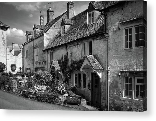 Britain Acrylic Print featuring the photograph Cotswold stone houses line the streets in Painswick by Seeables Visual Arts