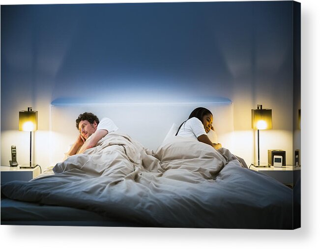 Problems Acrylic Print featuring the photograph Couple ignoring each other on bed by Portra