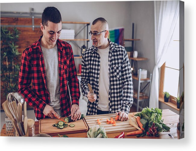 Young Men Acrylic Print featuring the photograph Couple making lunch together by South_agency