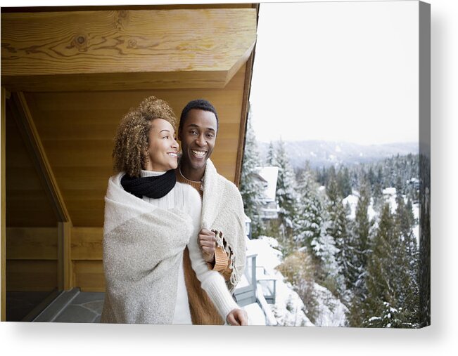 Mid Adult Acrylic Print featuring the photograph Couple wearing a blanket by Image Source
