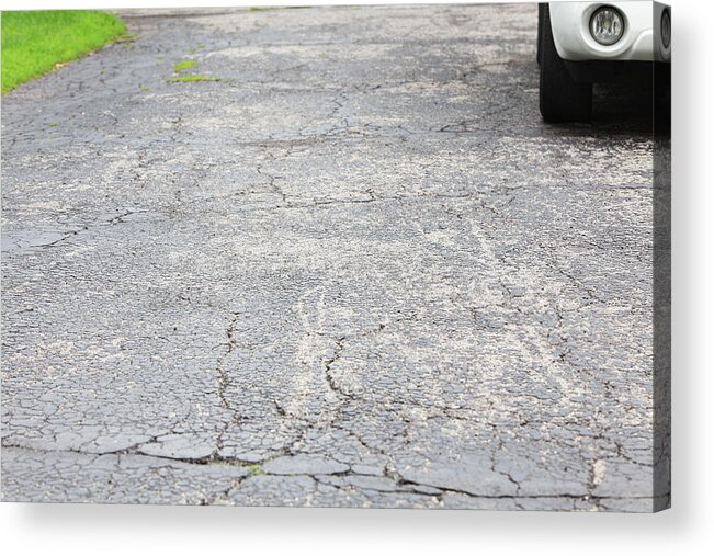 Grass Acrylic Print featuring the photograph Cracked asphalt driveway with car parked by Willowpix
