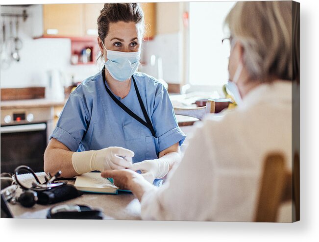 Cold And Flu Acrylic Print featuring the photograph District nurse at home visit by Sanjeri
