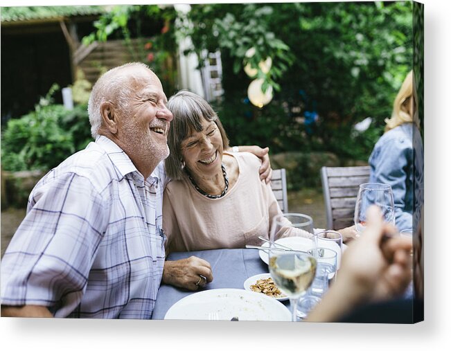 People Acrylic Print featuring the photograph Elderly Couple Enjoying Outdoor Meal With Family by Hinterhaus Productions