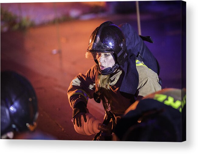 Working Acrylic Print featuring the photograph Female firefighter helping injured by Vm