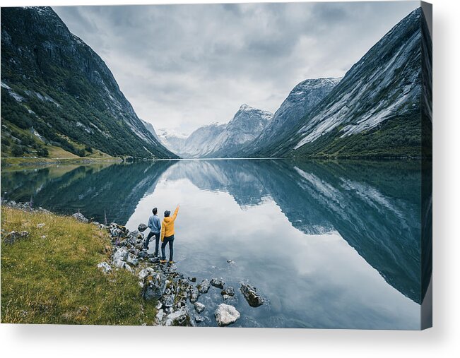 Tranquility Acrylic Print featuring the photograph Friends admiring the view on the banks of a norwegian fjord, Norway by © Marco Bottigelli