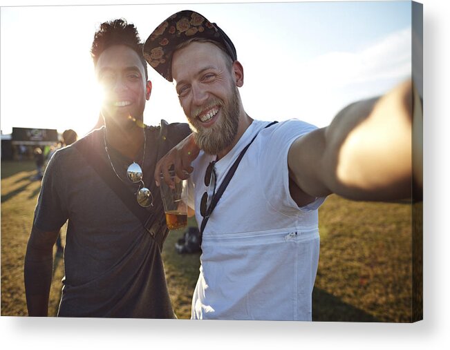 Young Men Acrylic Print featuring the photograph Friends making selfie at big festival concert by Klaus Vedfelt