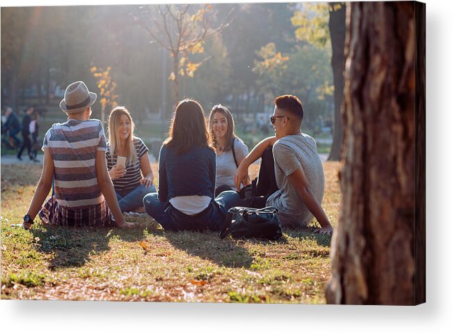 Diversity Acrylic Print featuring the photograph Group of five friends laughing out loud outdoor, sharing good and positive mood by Nemke