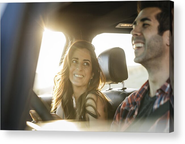 Mid Adult Acrylic Print featuring the photograph Happy couple driving in car on road trip by The Good Brigade