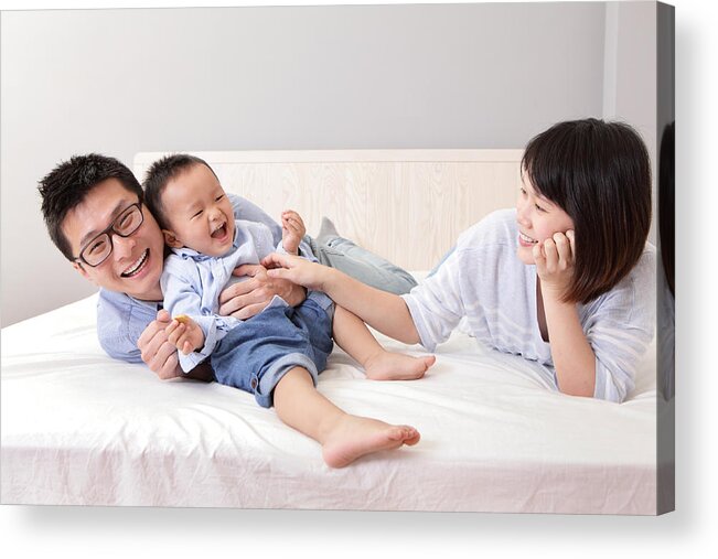 Asian And Indian Ethnicities Acrylic Print featuring the photograph Happy Family Playing On White Bed by RyanKing999
