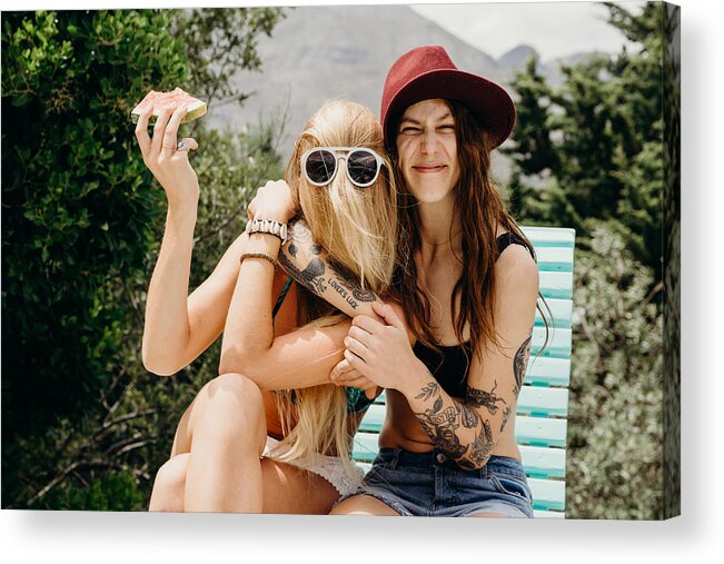 Cool Attitude Acrylic Print featuring the photograph Happy oddball girlfriends embrace outdoors with watermelon in hand by Hello World