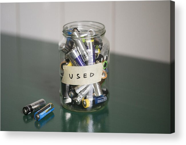 The End Acrylic Print featuring the photograph High angle view of batteries in glass jar with USED label on table by Halfdark
