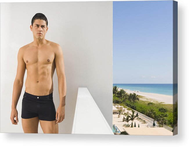 Three Quarter Length Acrylic Print featuring the photograph Hispanic man in bathing suit on balcony by PBNJ Productions